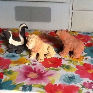 Three signed Don Thomas figurines.